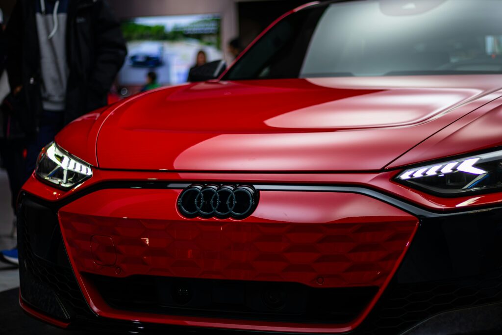 Close-up of a sleek red Audi in Toronto, showcasing modern automotive design.